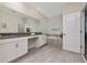Spacious bathroom with double vanity, soaking tub, and tile flooring at 2770 Bookmark Dr, Kissimmee, FL 34746