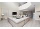 Spacious living room with a large sectional sofa and high ceilings at 2770 Bookmark Dr, Kissimmee, FL 34746