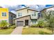 Modern two-story home with stone accents and a two-car garage at 2770 Bookmark Dr, Kissimmee, FL 34746