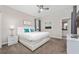 Main bedroom with a king-size bed, white nightstands, and carpet flooring at 2770 Bookmark Dr, Kissimmee, FL 34746