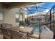 Relaxing patio area with pool and outdoor dining set at 2770 Bookmark Dr, Kissimmee, FL 34746