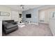 Living room with sectional sofa and flat-screen TV at 2770 Bookmark Dr, Kissimmee, FL 34746