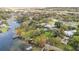 Aerial view of waterfront property with pool and dock at 3314 Trentwood Blvd, Belle Isle, FL 32812