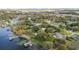 Aerial view of waterfront property with a pool at 3314 Trentwood Blvd, Belle Isle, FL 32812