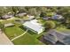 Aerial view of a single-story house with a metal roof and large yard at 3314 Trentwood Blvd, Belle Isle, FL 32812