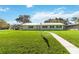 Ranch style home with green exterior, landscaped lawn, and walkway at 3314 Trentwood Blvd, Belle Isle, FL 32812