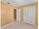 Spacious bedroom with double door closet and carpet flooring at 3314 Trentwood Blvd, Belle Isle, FL 32812