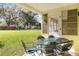 Screened patio with table and chairs at 3314 Trentwood Blvd, Belle Isle, FL 32812