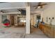 Outdoor patio with seating area, ceiling fans, and outdoor kitchen at 36 Allenwood Look, Ormond Beach, FL 32174