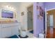 Clean bathroom with single vanity, shower, and linen closet at 36 Allenwood Look, Ormond Beach, FL 32174