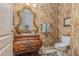 Elegant powder room with ornate vanity and decorative mirror at 36 Allenwood Look, Ormond Beach, FL 32174