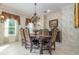 Elegant dining room with a chandelier and ornate furniture at 36 Allenwood Look, Ormond Beach, FL 32174