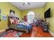 Bright bedroom with hardwood floors, and plenty of wall space for decor at 36 Allenwood Look, Ormond Beach, FL 32174