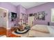Charming bedroom with hardwood floors and built-in shelving at 36 Allenwood Look, Ormond Beach, FL 32174