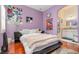 Serene bedroom with hardwood floors and access to a bathroom at 36 Allenwood Look, Ormond Beach, FL 32174