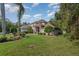 House exterior with fountain and landscaping at 36 Allenwood Look, Ormond Beach, FL 32174