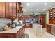 Large kitchen with wood cabinets, granite countertops, and stainless steel appliances at 36 Allenwood Look, Ormond Beach, FL 32174