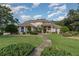 Two story home with landscaped lawn at 36 Allenwood Look, Ormond Beach, FL 32174