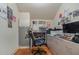 Home office features built-in desk and cabinets, hardwood floors, and plenty of workspace at 36 Allenwood Look, Ormond Beach, FL 32174
