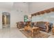 Spacious living room with high ceilings, elegant furniture, and a view to another room at 36 Allenwood Look, Ormond Beach, FL 32174