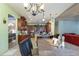 Well-equipped kitchen with an island, wood cabinets, and granite countertops at 36 Allenwood Look, Ormond Beach, FL 32174