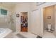 Spacious bathroom with a large walk-in shower, soaking tub, and walk-in closet at 36 Allenwood Look, Ormond Beach, FL 32174