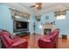Cozy Gathering room with a fireplace, hardwood floors, and comfortable seating at 36 Allenwood Look, Ormond Beach, FL 32174