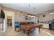 Game room with a pool table, kitchenette, and views into other rooms at 36 Allenwood Look, Ormond Beach, FL 32174