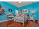 Cheerful bedroom with hardwood floors and white furniture at 36 Allenwood Look, Ormond Beach, FL 32174