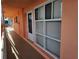 Building hallway with unit entrances and light colored walls at 721 S Beach St # 217A, Daytona Beach, FL 32114