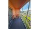 Spacious balcony with seating area and tranquil community views at 721 S Beach St # 217A, Daytona Beach, FL 32114