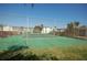 Green tennis court with chain link fence at 721 S Beach St # 217A, Daytona Beach, FL 32114