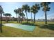 Condominium complex with palm trees and green space at 721 S Beach St # 217A, Daytona Beach, FL 32114