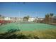 Green tennis court with chain link fence at 721 S Beach St # 217A, Daytona Beach, FL 32114
