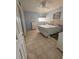 Bedroom with double bed, tiled floors and light blue walls at 721 S Beach St # 217A, Daytona Beach, FL 32114