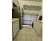Kitchen area with white cabinets, stainless steel appliances, and tiled floor at 721 S Beach St # 217A, Daytona Beach, FL 32114