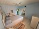 Bright bedroom with tiled floors and wicker furniture at 721 S Beach St # 217A, Daytona Beach, FL 32114