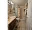 Clean bathroom with shower, vanity, and tiled floor at 721 S Beach St # 217A, Daytona Beach, FL 32114