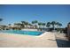 Community pool with lounge chairs and waterfront view at 721 S Beach St # 217A, Daytona Beach, FL 32114