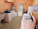 Clean laundry room with multiple washers and dryers at 721 S Beach St # 217A, Daytona Beach, FL 32114
