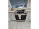Stainless steel oven with a smooth cooktop in a bright kitchen at 721 S Beach St # 217A, Daytona Beach, FL 32114