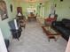 Living room with brown leather couch and coffee table at 721 S Beach St # 217A, Daytona Beach, FL 32114