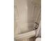 Bathroom featuring a jetted bathtub and tiled walls at 721 S Beach St # 217A, Daytona Beach, FL 32114