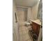 Bathroom with tub, vanity, and updated tile flooring at 721 S Beach St # 217A, Daytona Beach, FL 32114
