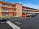 Building exterior with parking lot and reserved spots at 721 S Beach St # 217A, Daytona Beach, FL 32114