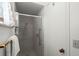 Shower stall with glass enclosure and neutral tile at 8613 Tarragon Drive, Orlando, FL 32825