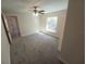 Bright bedroom featuring carpet, neutral walls, and a window at 8749 Se 159Th Ln, Summerfield, FL 34491