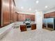 Modern kitchen with granite countertops and stainless steel appliances at 9344 Tyrella Pine Trl, Winter Garden, FL 34787