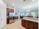 Open kitchen with island and view into living area at 9344 Tyrella Pine Trl, Winter Garden, FL 34787