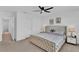 Spacious bedroom with king-size bed and access to hallway at 1174 Seaside Mist Trl, Kissimmee, FL 34747